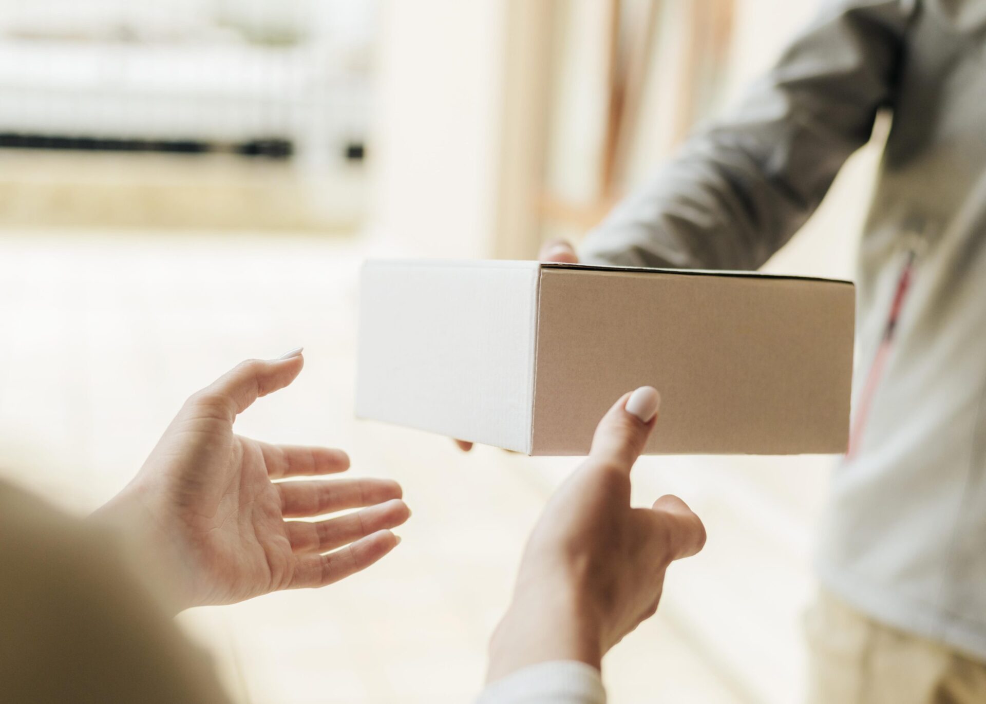 close-up-hands-getting-box-scaled