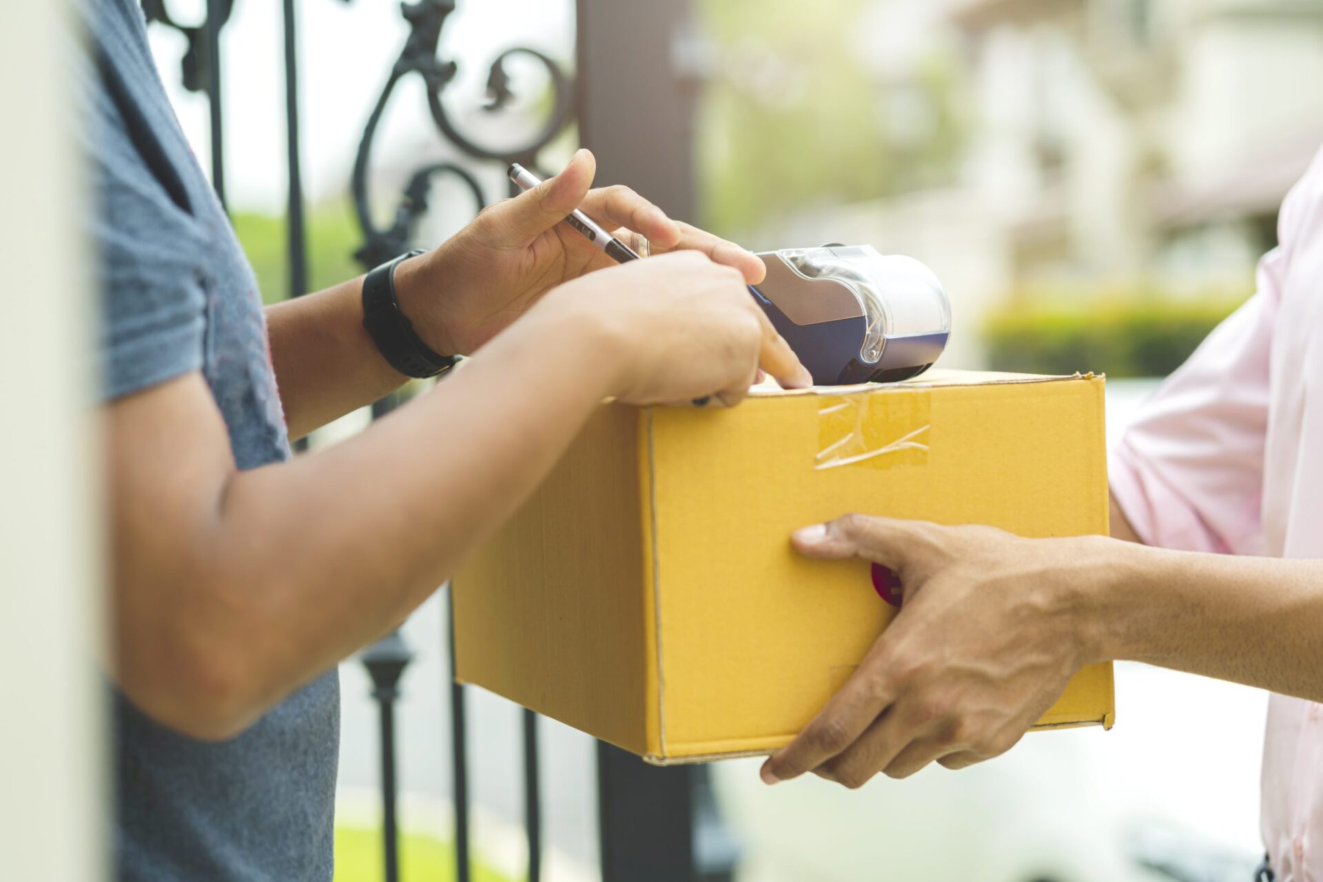 delivery-ideas-concept-close-up-indian-messenger-handle-package-product-customer-with-happiness-cheerful-house-door-entrance-scaled